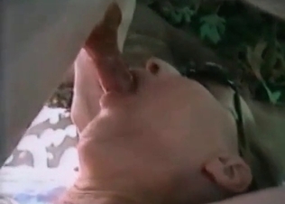 Watch her sucking an animal cock
